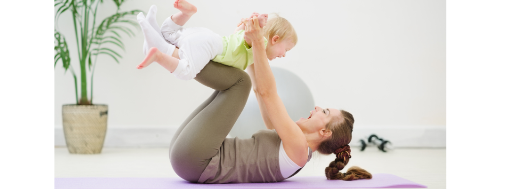 A mum and baby enjoy some Pilates together 
