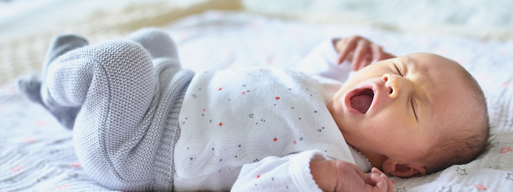 baby sleep advice - the photo shows a baby yawning