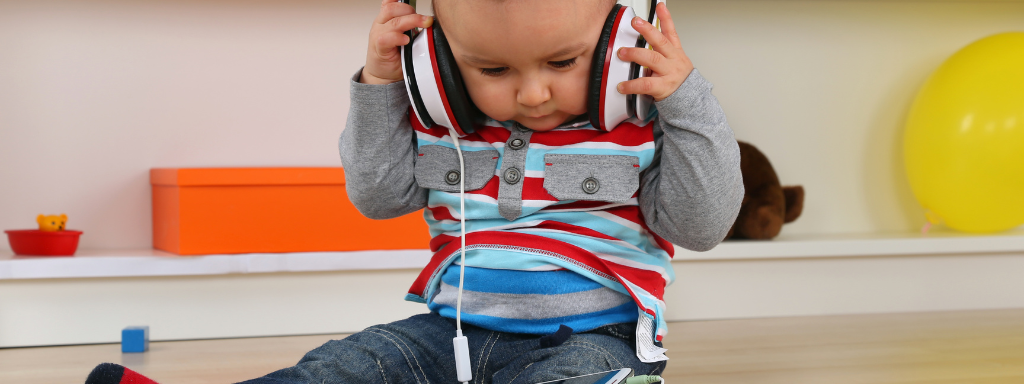 parenting podcasts - the photo shows a baby wearing headphones