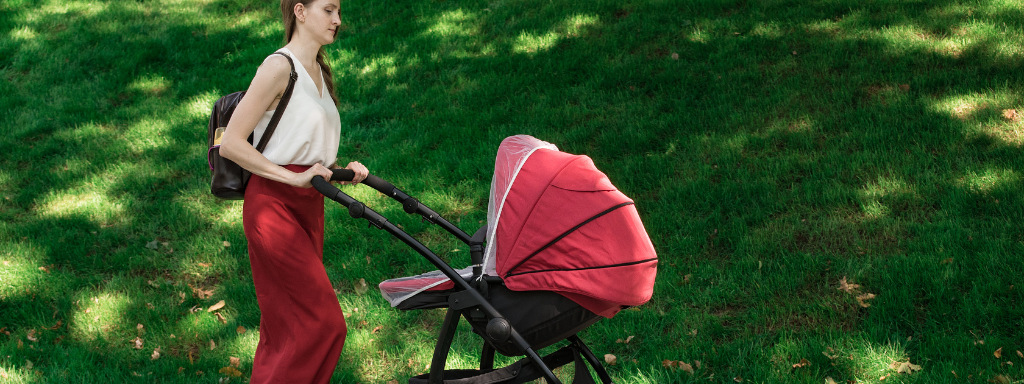 parenting podcasts - the photo shows a mum walking along and pushing a buggy