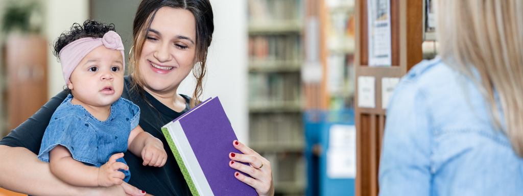 new parent perks and activities - the photo shows a mum and baby in the library