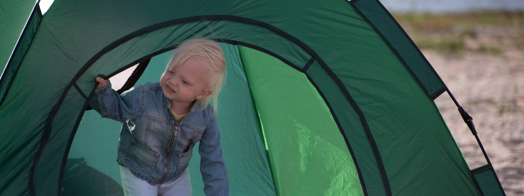 toddler party alternatives - the photo shows a toddler in a tent