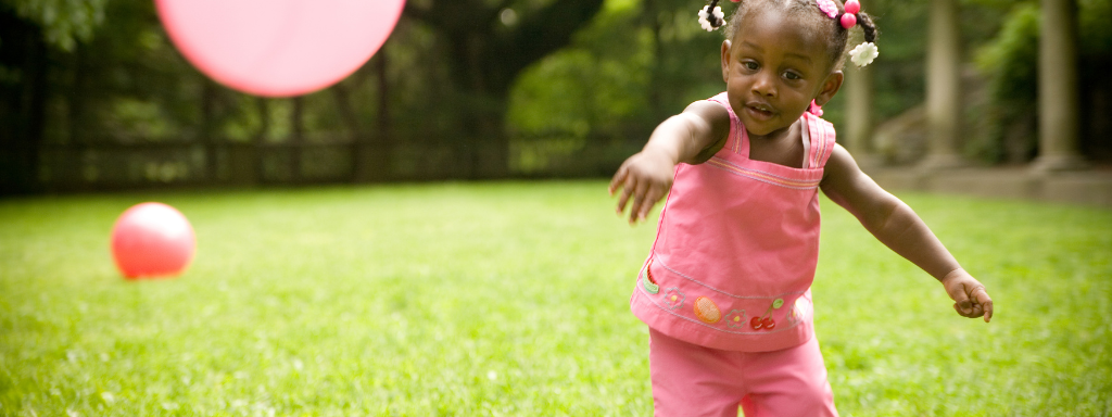 toddler party alternatives - the photo shows a child throwing a ball