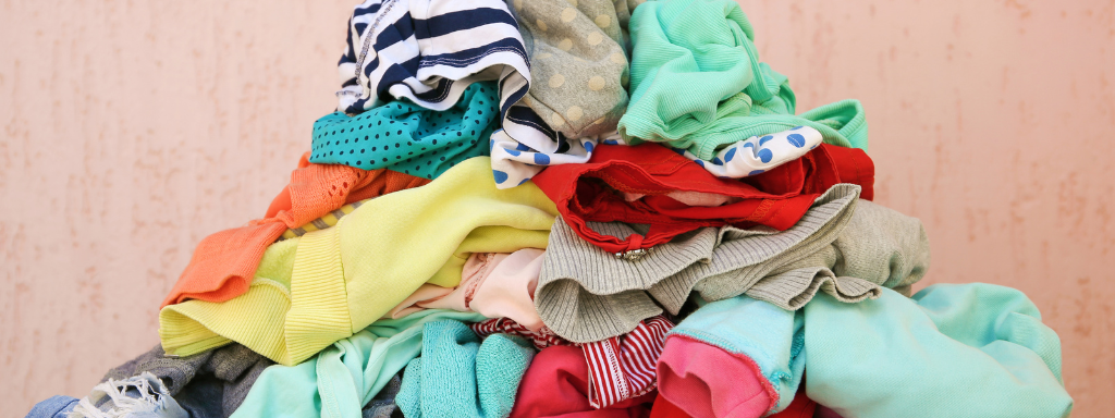 Clear Out Child's Old Clothes - the photo shows a bundle of clothes