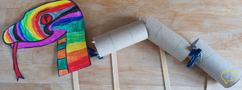 St Patrick's Day toddler crafts - the photo shows a picture of a toilet roll snake with colourful snake's face